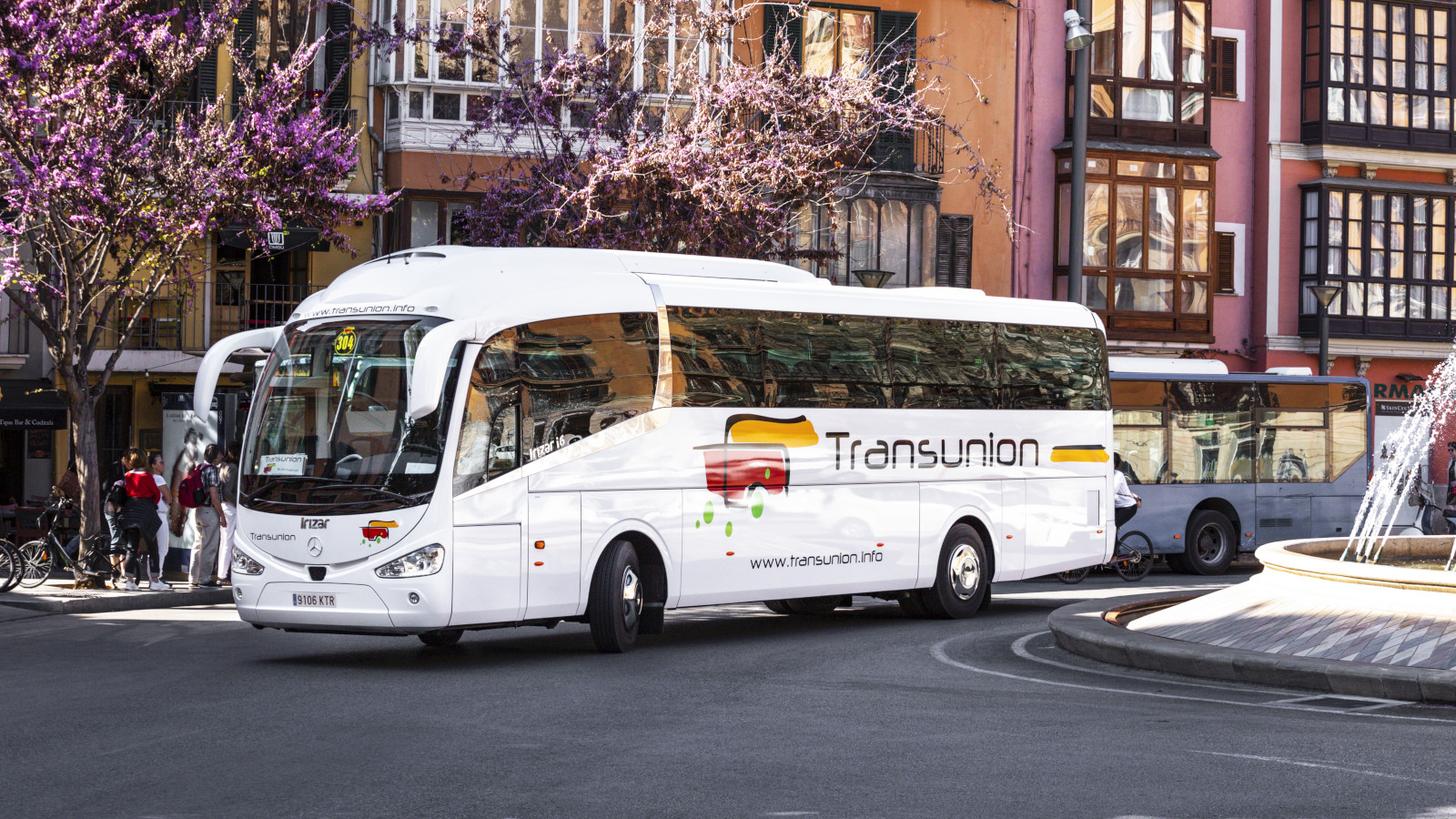 Passengers boarding a Transunion coach